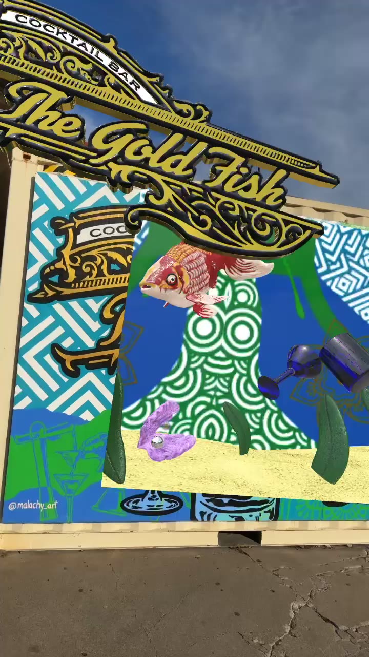 An AR mural activation with animated 3D goldfish over a painted wall.